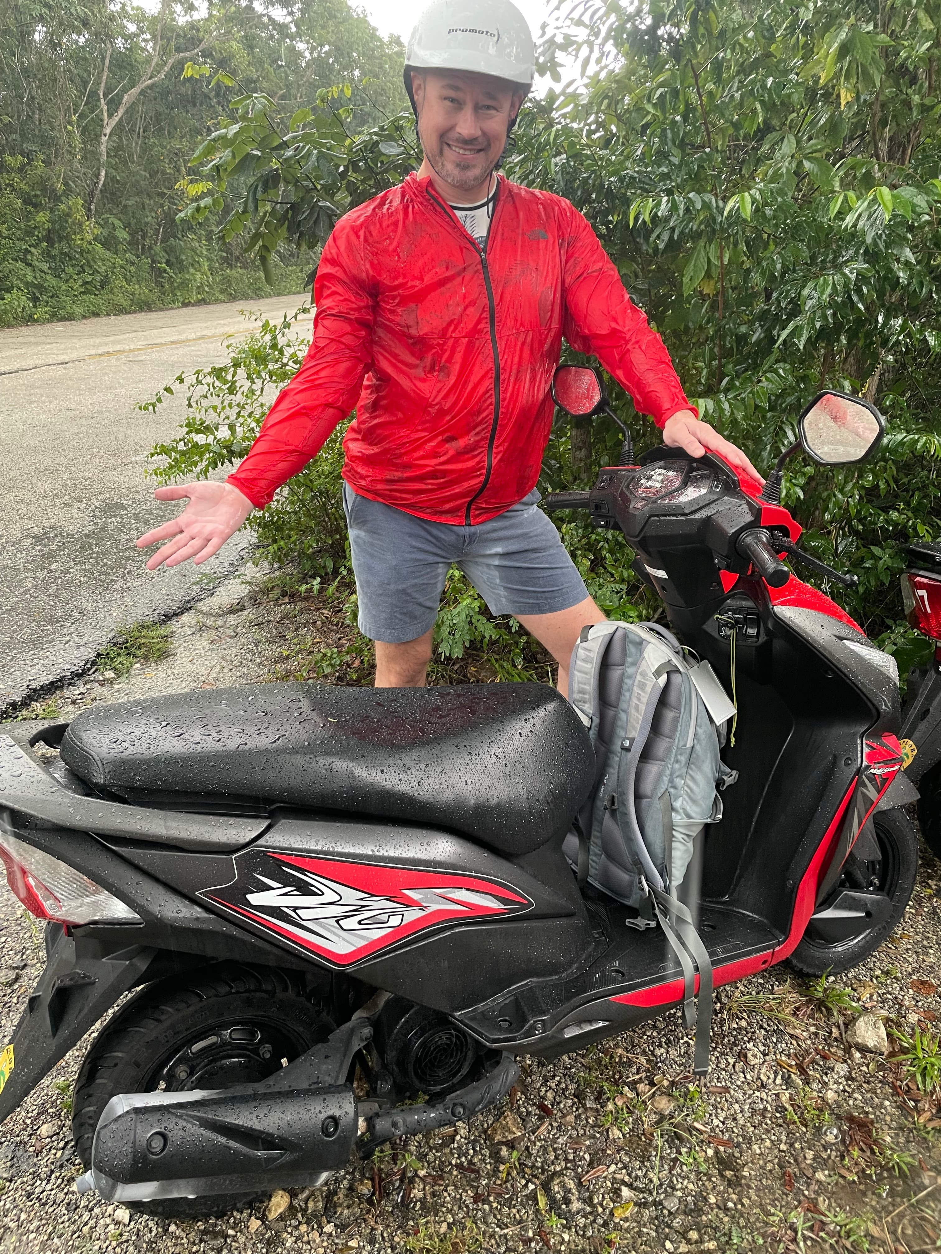 Kyle soaked through after riding a motorcycle into a rainstorm in Cozumel, Mexico